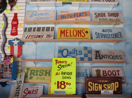 Signs for sale at George the Sign Painters booth at Shipshewana Flea Market