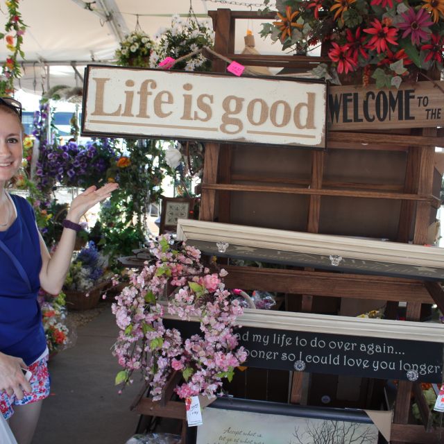 Girl with life is good sign at flea market in Shipshewana Indiana