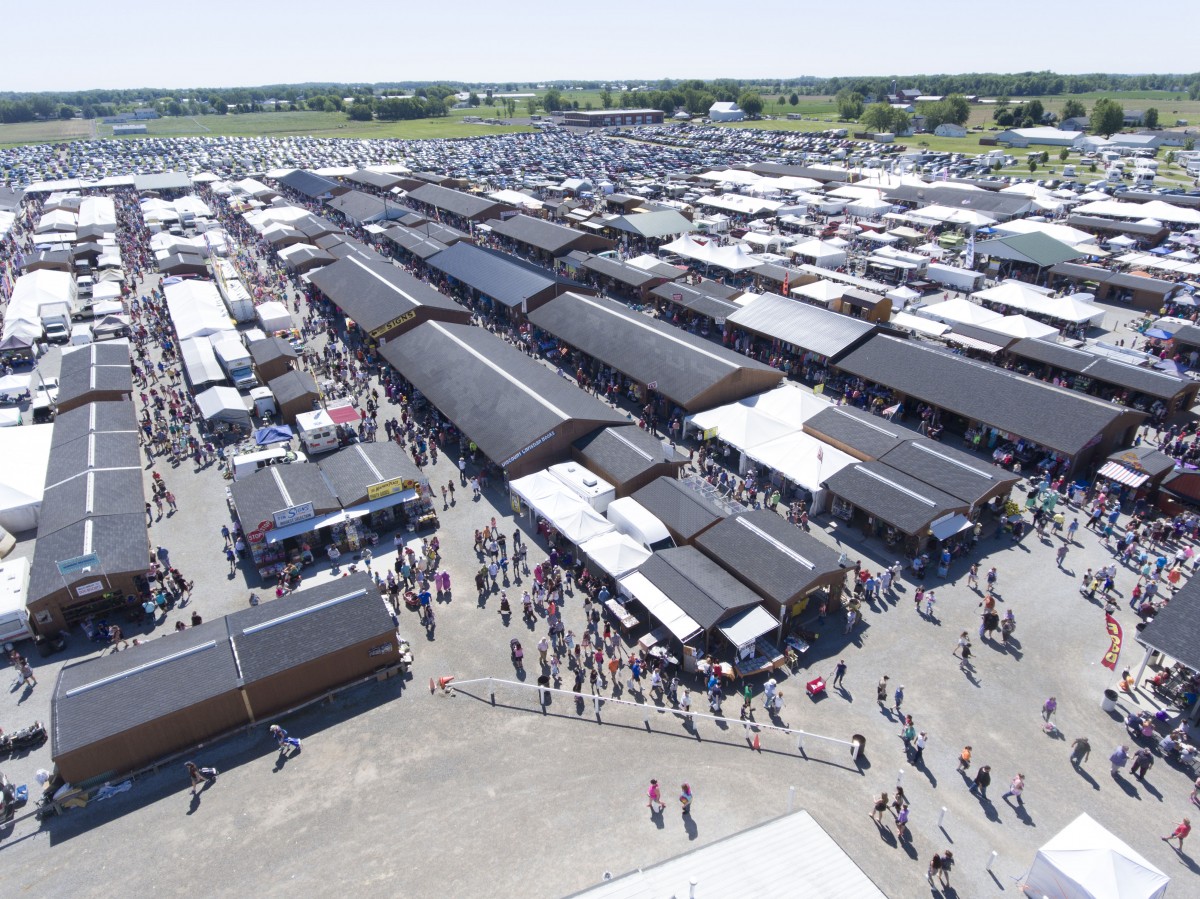 Aerial view of Shipshewana Flea Market Memorial Day crowds, buildings and tents.