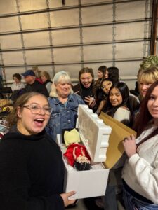 students winning live auction bid