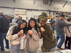 students sharing auction finds