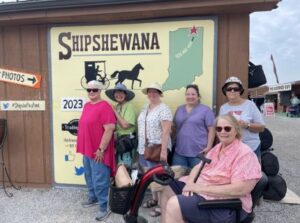 shipshewana flea market mural with family shopping